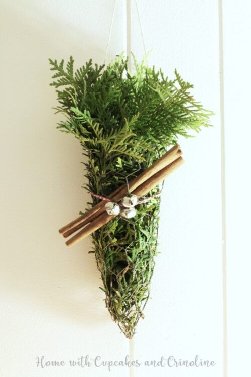 Rustic Wall Decor using greens and cinnamon sticks via Home with Cupcakes and Crinoline