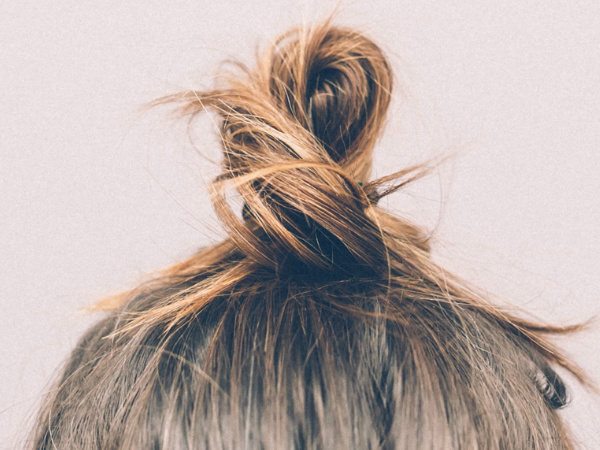 Hair in Bun: How to Clean Your House After Head Lice