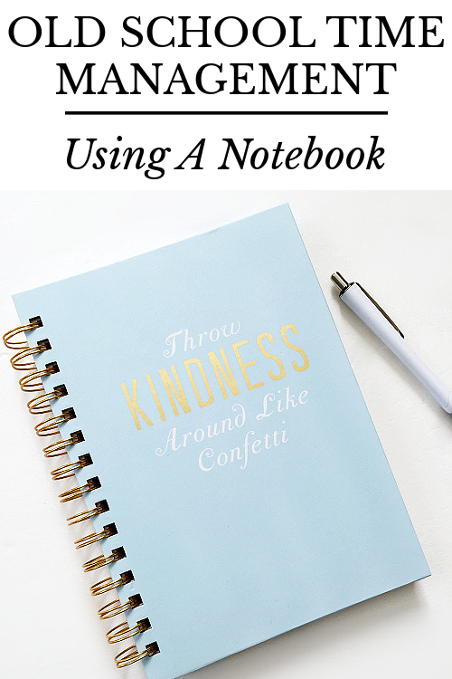 Small light blue spiral notebook with pen