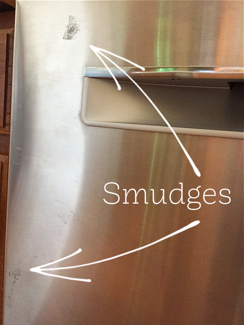 Stainless steel appliance showing smudges before cleaning