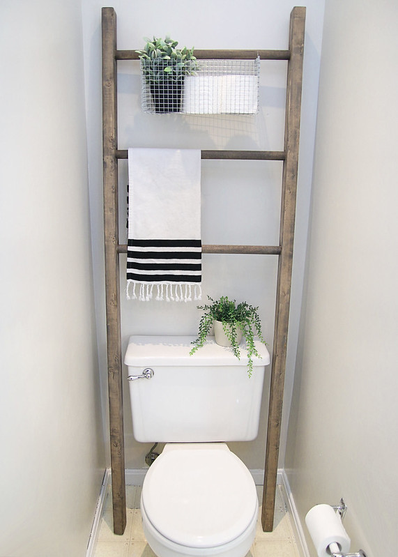 Farmhouse ladder above toilet in bathroom. Via Elizabeth Joan Designs