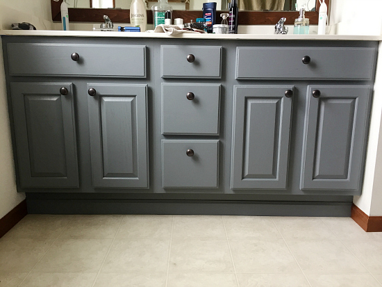 Freshly painted vanity with added knobs on doors and drawers