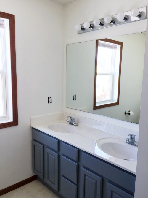 Master Bathroom with freshly painted vanity and white walls.