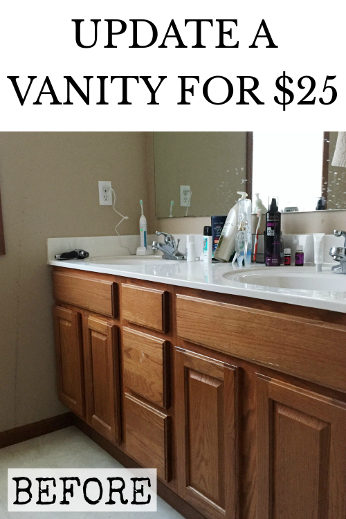 Outdated oak vanity in bathroom prior to painting and adding knobs