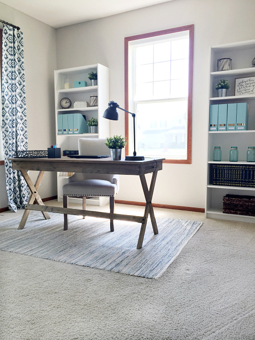 This farmhouse office transformation is incredible. Freshly painted walls, new curtains, bookshelves, and desk, 