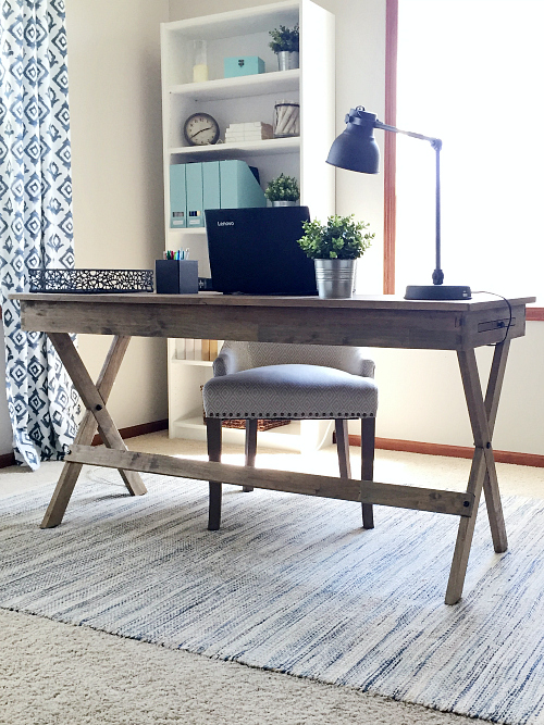 View of office with floating desk in the middle of the room. Most cords are hidden out of view using simple tricks found in post.