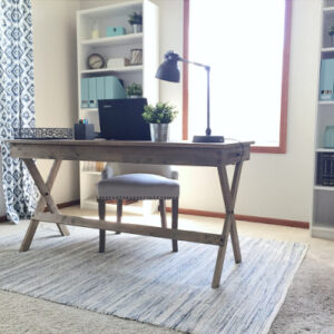 Farmhouse style desk placed in the center of a home office