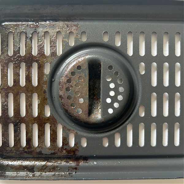 Before and After of Air Fryer Grate cleaned with baking soda