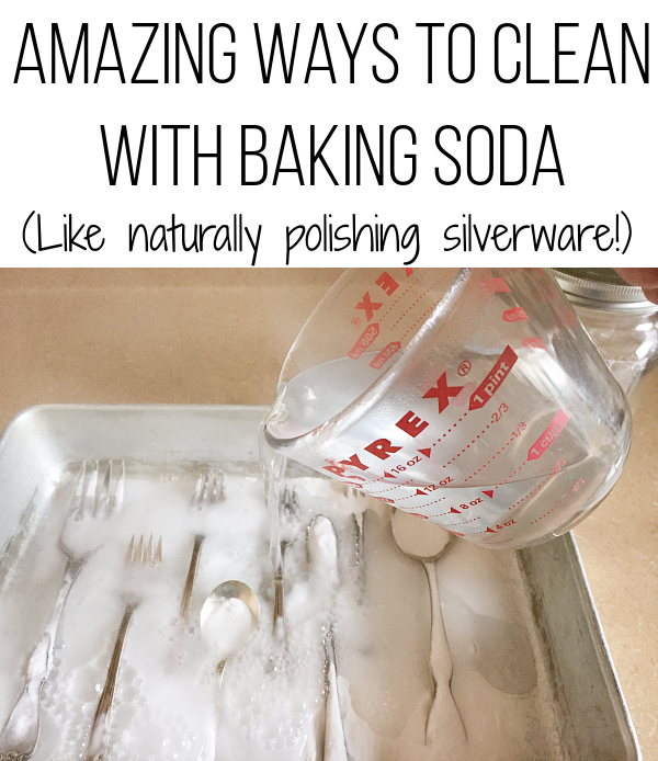 Pouring boiling water over silverware covered in baking soda to naturally polish it