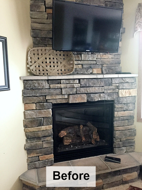Stone fireplace with stone slab mantel