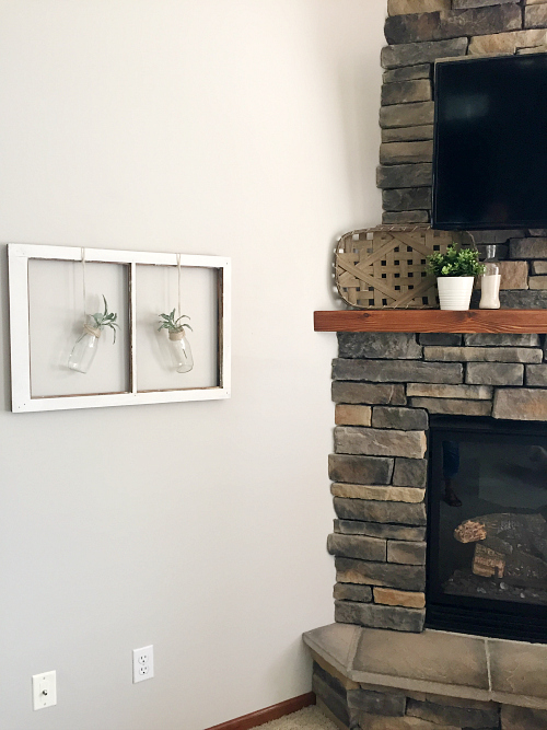 $80 Living room makeover done for the $100 Room Challenge: View of fireplace and DIY farmhouse wall decor using an old window frame