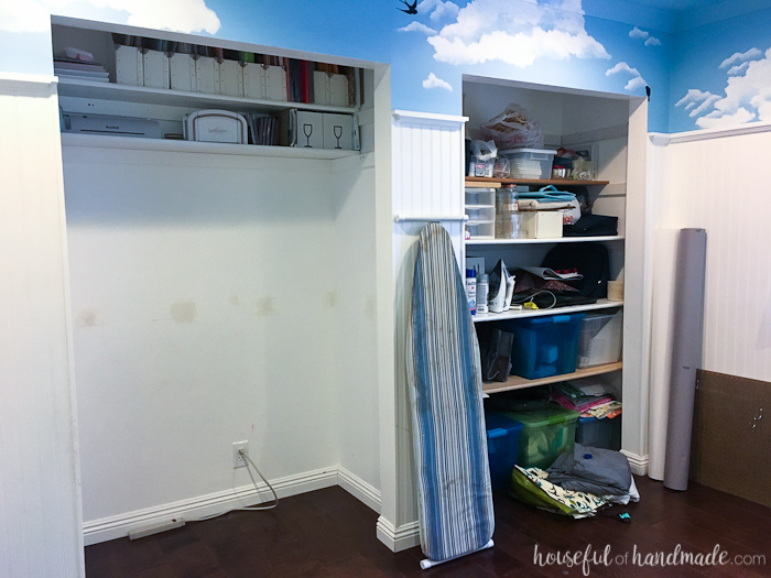 Craft room prior to $100 room makeover featuring walls painted with cloud patterns