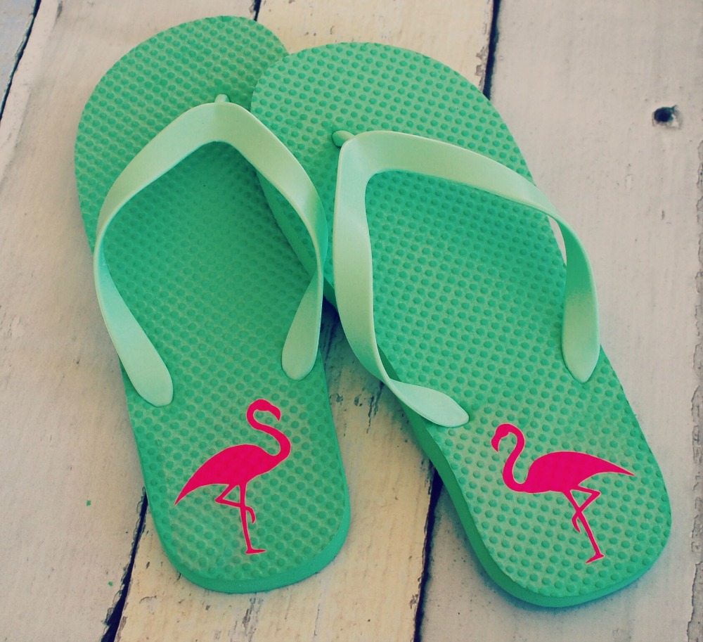 Vinyl flamingo cut-outs applied to green flip flops