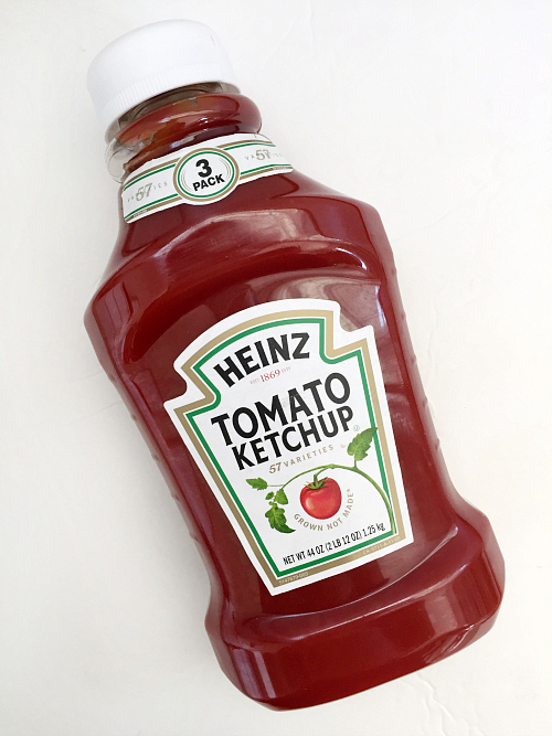 Bottle of ketchup to be used to remove rust