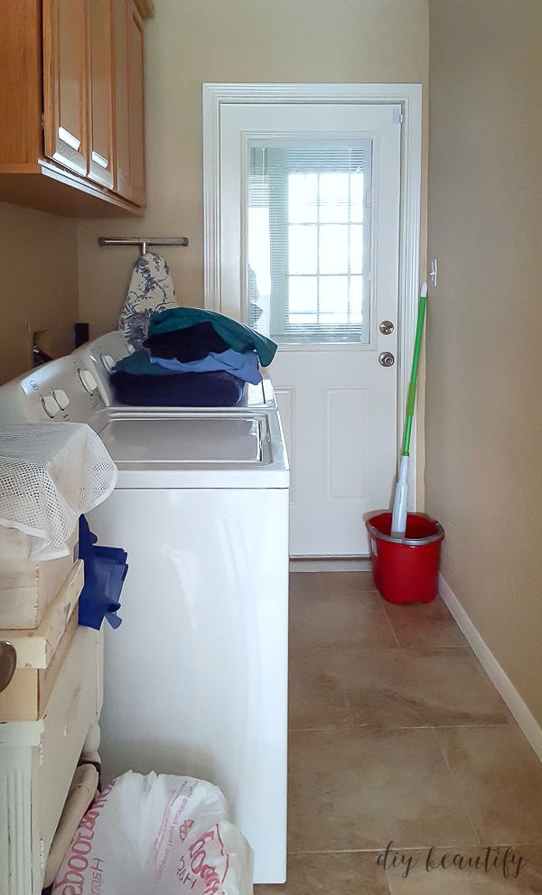 Laundry room prior to $100 makeover.