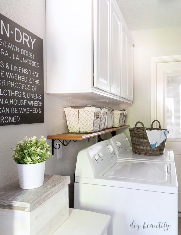 Farmhouse style laundry room after $100 makeover. 