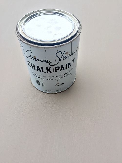 Annie Sloan chalk paint being used to create a weathered wood look on an entry table. Second coat.