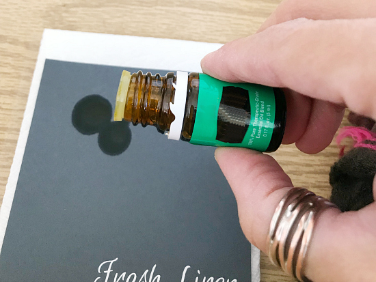 Adding a few drops of essential oil to cardstock to freshen drawers.