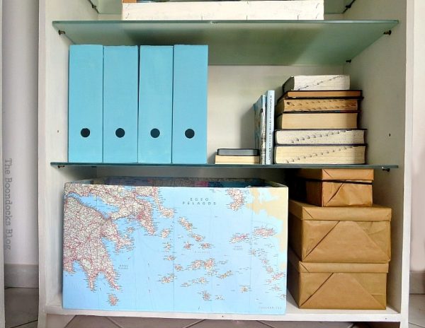 Boxes covered in maps to use as storage in the office