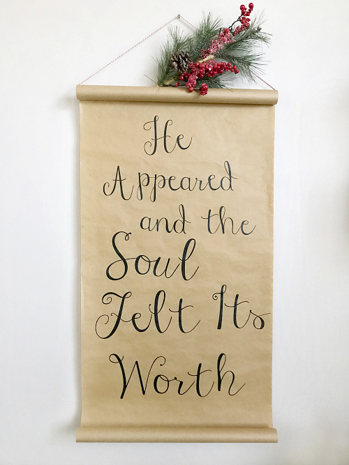 DIY Christmas scroll hung with Christmas stem on top