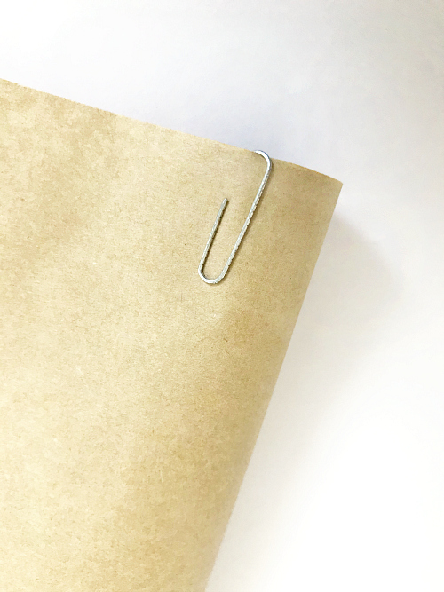 Paper clip place on edge of DIY Christmas Scroll to hold roll in place