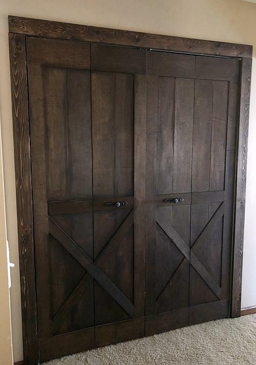 Finished DIY Bifold Barn Door with matching trim around door frame