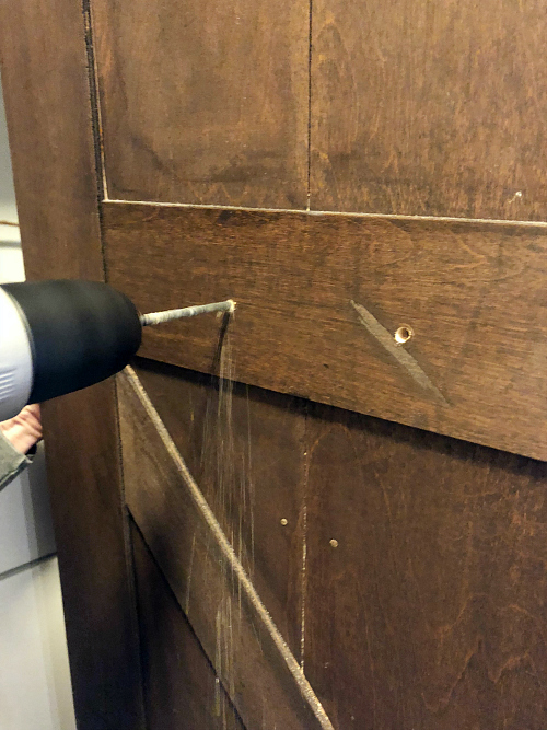 Drilling holes in a bifold barn door to add new hardware