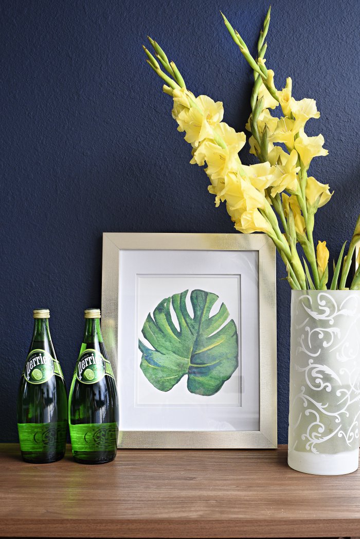 Framed botanical print placed on beverage cart