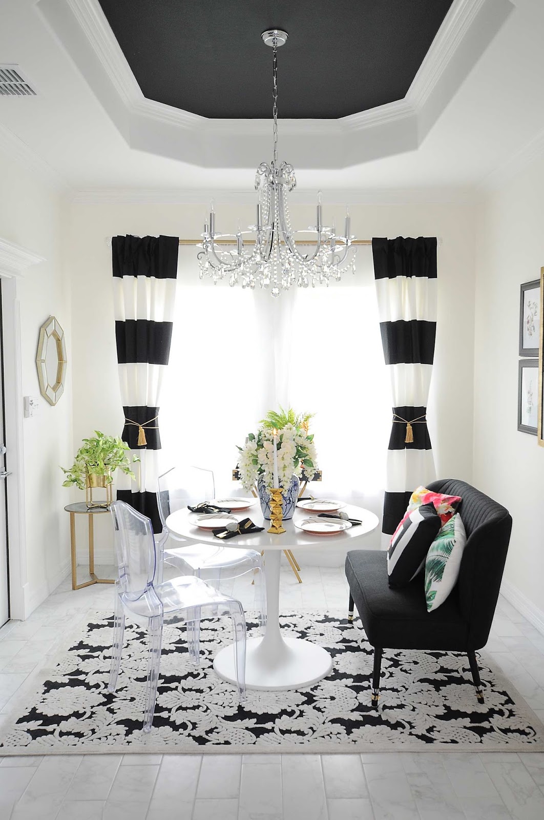 Dining room after $100 makeover. Fresh curtains, rug.