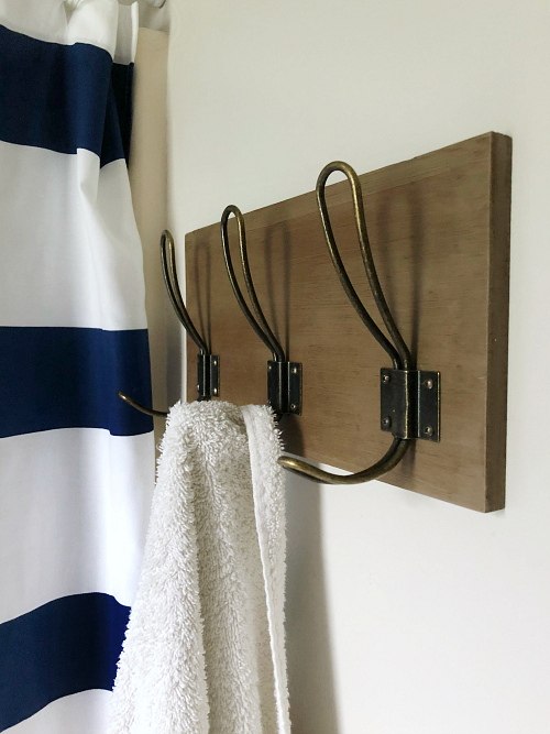 Farmhouse style towel hooks in classic farmhouse bathroom