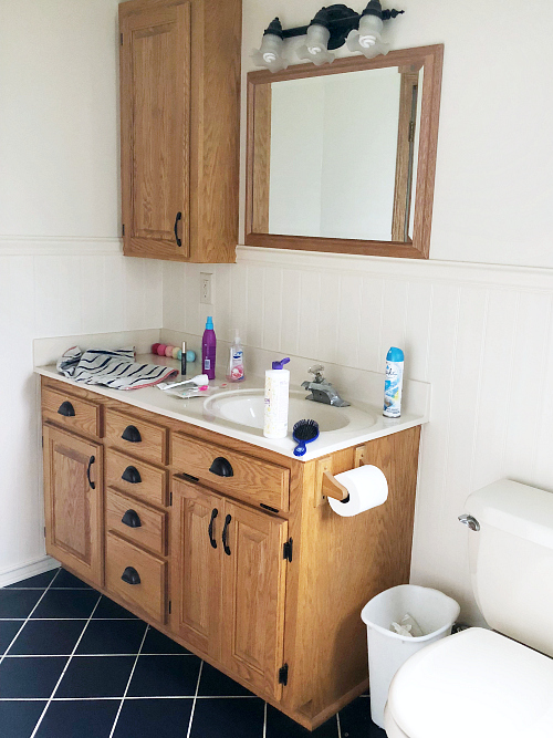 Basement Bathroom Before Showing Navy Tile Floor Prior to Stenciling