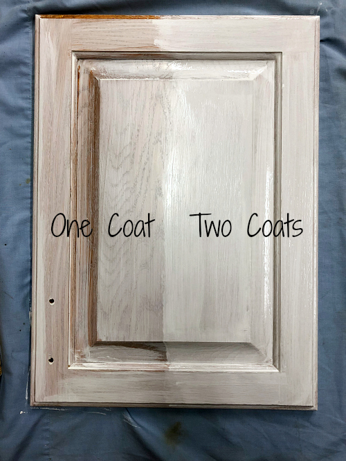 Side by side comparison of one vs two coats of primer on vanity door