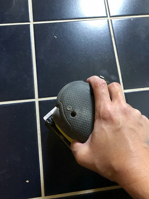 Sanding tile floor prior to painting and stenciling