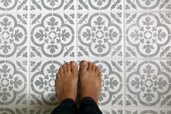 This tutorial for a DIY stenciled floor is amazing! So much great information. Step-by-step pictures, lessons learned, etc. #stenciledfloor #diystenciledfloor #floorstencil