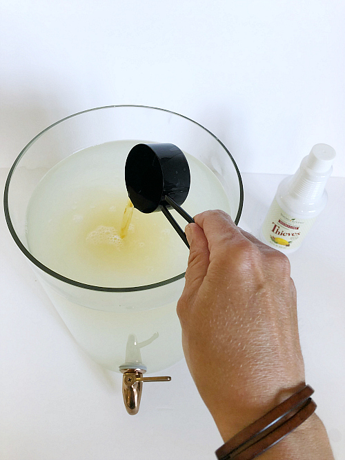 This DIY Laundry Detergent is free of harsh chemicals and costs less than $4/gallon. So easy to make and smells amazing! #laundrysoap #laundrydetergent #thieves #essentialoils