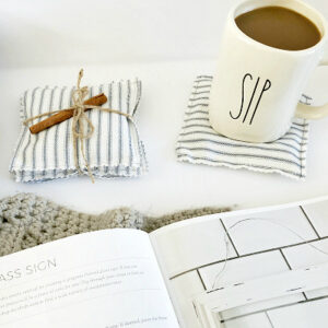 DIY Scented coasters displayed with coffee mug and an open farmhouse style DIY book