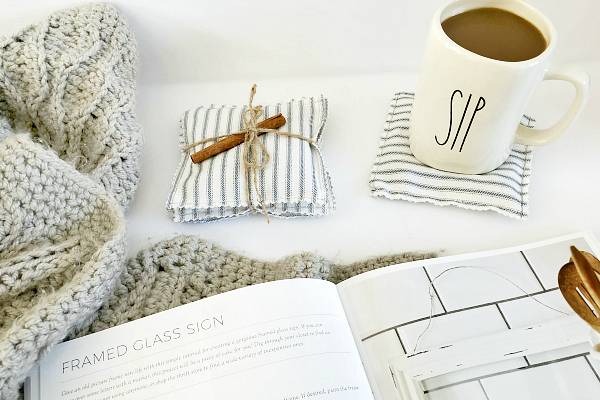 DIY Scented coasters displayed with coffee mug and an open farmhouse style DIY book