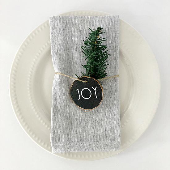 Using wood slice ornaments as napkin rings
