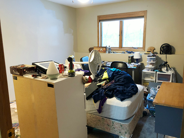 A very messy boy bedroom in the middle of a $100 makeover. 