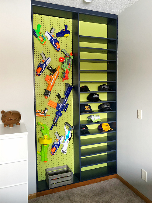 Boy Bedroom Nerf Gun Wall in a built-in shelving unit