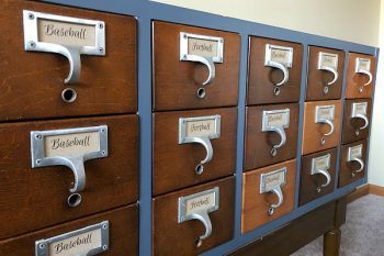 This idea is genius! Store football and baseball cards in a card catalog! Love the makeover! #baseballcards #organizationideas