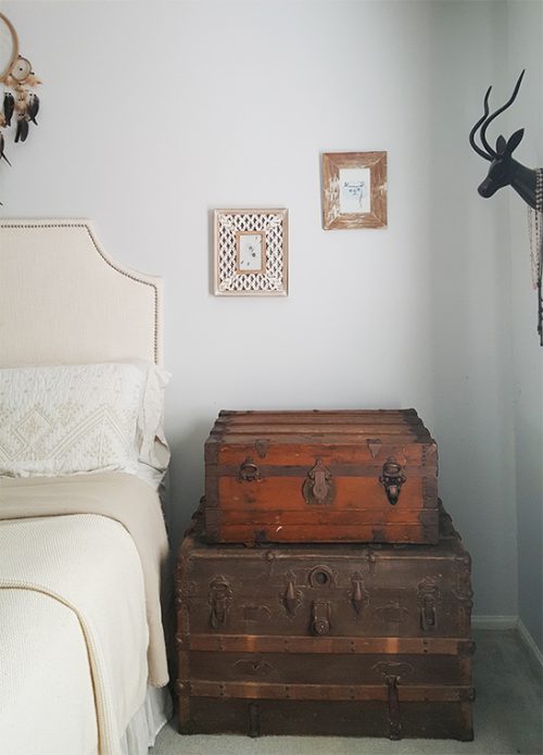 Stacked steamer trunks being used as a nightstand