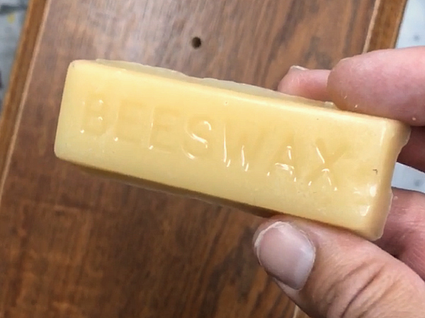 Beeswax bar used to distress furniture