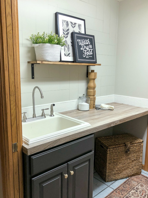 $100 Laundry room makeover with newly painted vanity and faux wood countertop