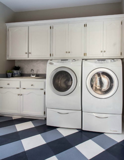 $100 Laundry room makeover featuring a painted buffalo check floor and faux marble backsplash