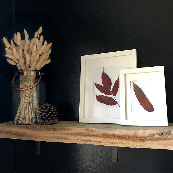 Wood Shelf in Bathroom with Framed Art made of fall leaves