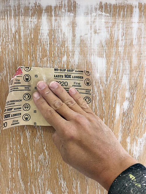 Sanding cabinet about applying joint compound in order to hide wood grain