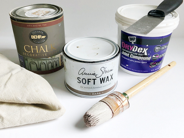 What You'll Need to Hide Wood Grain on Oak Cabinets: Joint compound, chalk paint, wax, towels, and paintbrush