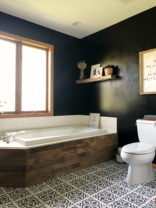 Black and white stenciled floor in modern farmhouse style bathroom
