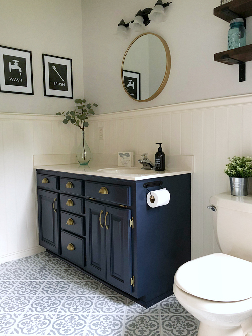 Tile floor stenciled with floor paint during a $100 bathroom makeover